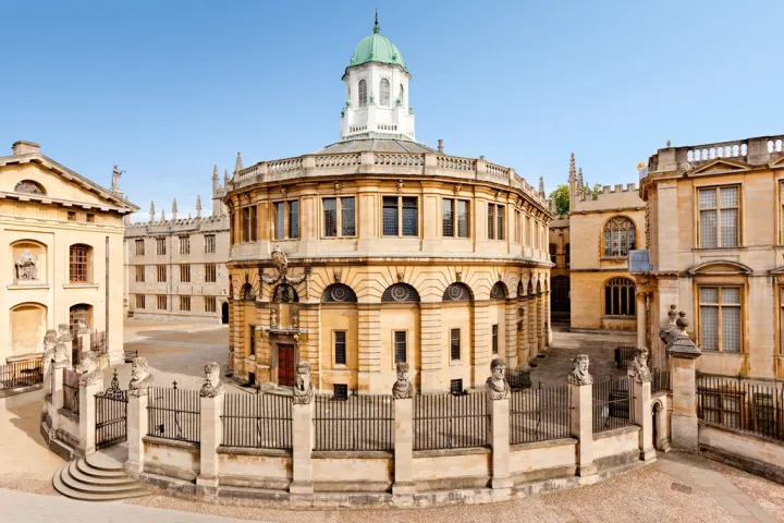 a large stone building with Sheldonian Theatre in the background