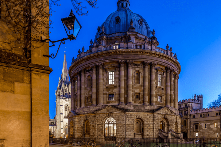 a clock tower in front of a building