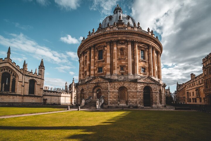 Historic circular building with dome under a partly cloudy sky.