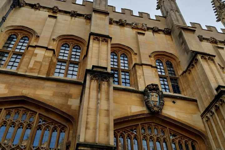 a large stone statue in front of a building
