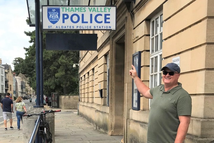 a person standing on a sidewalk