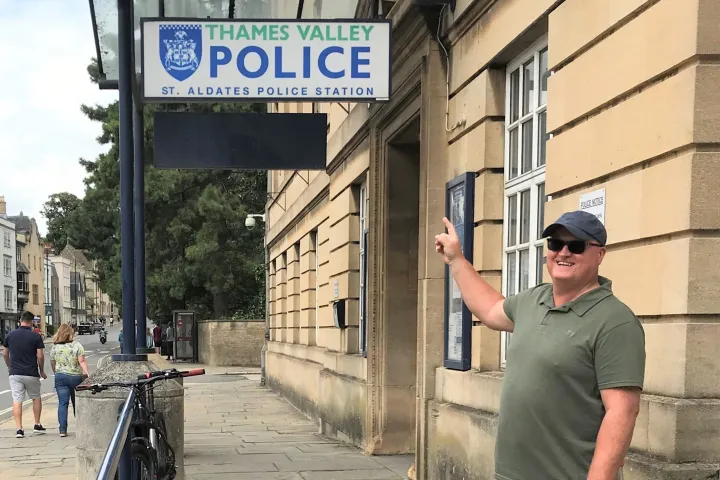 a person standing on a sidewalk