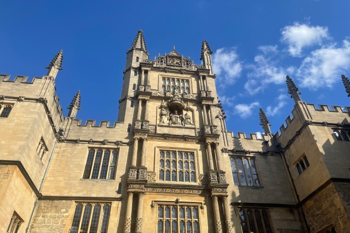 a large tall tower with a clock at the top of a building