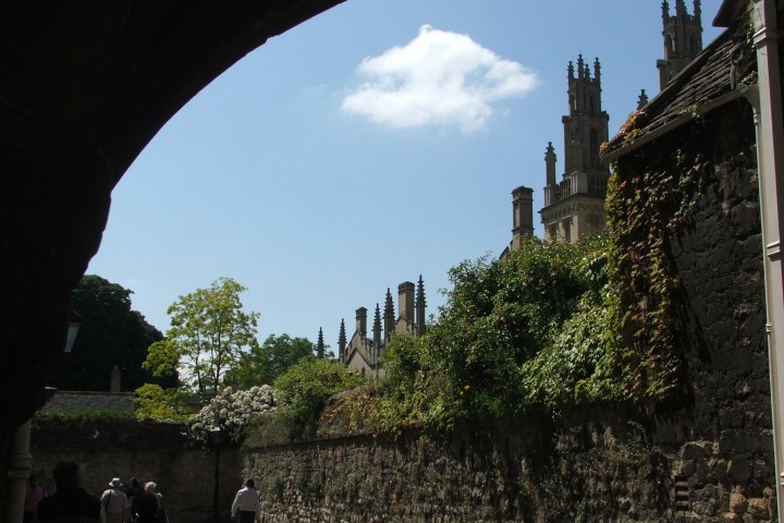 a group of people standing in front of a castle