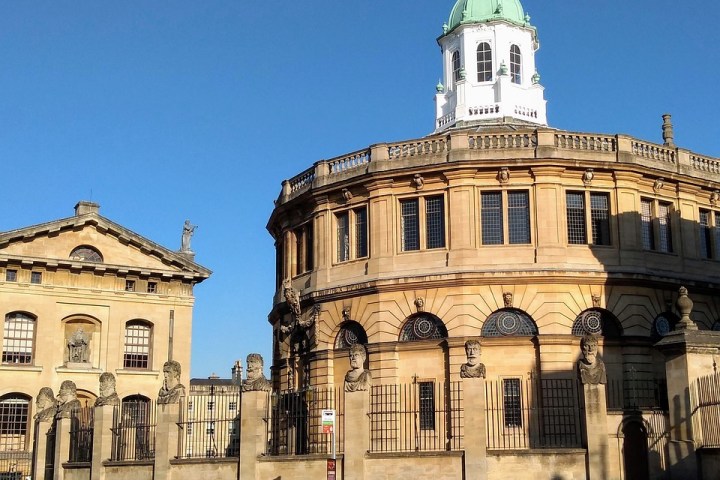 a large stone building with Sheldonian Theatre in the background